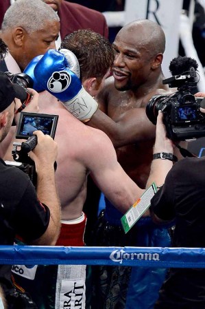LAS VEGAS, NV - SEPTEMBER 14: (R-L) Floyd Mayweather Jr. hugs Canelo Alvarez after their WBC/WBA 154-pound title fight at the MGM Grand Garden Arena on September 14, 2013 in Las Vegas, Nevada. (Photo by Ethan Miller/Getty Images)