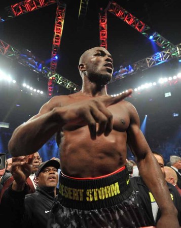 LAS VEGAS, NV - OCTOBER 12: WBO welterweight champion Timothy Bradley Jr. celebrates after defeating Juan Manuel Marquez (not pictured) during their bout at the Thomas & Mack Center on October 12, 2013 in Las Vegas, Nevada. Bradley won in a split-decision. (Photo by Jeff Bottari/Getty Images)
