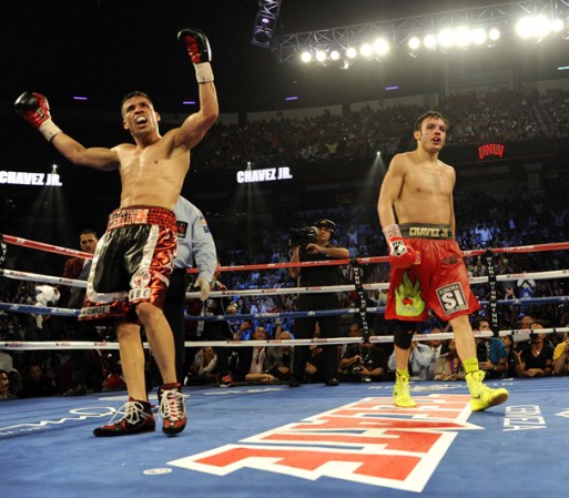 LAS VEGAS, NV - SEPTEMBER 15: Sergio Martinez (L) celebrates as Julio Cesar Chavez Jr. walks back to his corner after the eleventh round of their WBC middleweight title fight at the Thomas & Mack Center on September 15, 2012 in Las Vegas, Nevada. (Photo by Jeff Bottari/Getty Images)