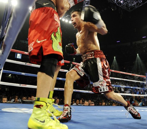 LAS VEGAS, NV - SEPTEMBER 15: Sergio Martinez (R) throws a left at Julio Cesar Chavez Jr. in the eleventh round of their WBC middleweight title fight at the Thomas & Mack Center on September 15, 2012 in Las Vegas, Nevada. (Photo by Jeff Bottari/Getty Images)