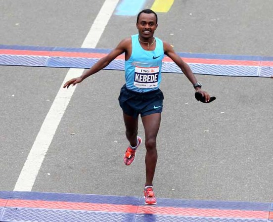 NEW YORK, NY - NOVEMBER 03: Tsegaye Kebede of Ethiopia crosses the finish line in second place during the 2013 ING New York City Marathon on November 3, 2013 in New York City. (Photo by Elsa/Getty Images)