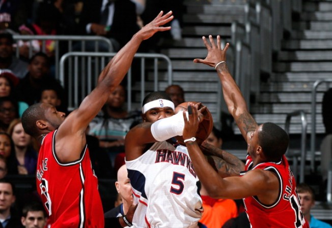 Dwyane Wade #3 y Mario Chalmers #15. El armador del Heat se ha agigantado un mundo.