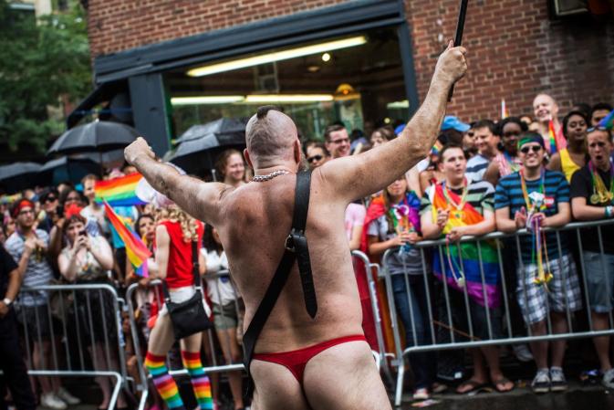 NEW YORK, NY - JUNE 30: Revelers march in the New York Gay Pride Parade on June 30, 2013 in New York City. This year's parade was a particularly festive occasion, due to the recent Supreme Court Ruling that it was unconstitutional to ban gay marriage. (Photo by Andrew Burton/Getty Images)