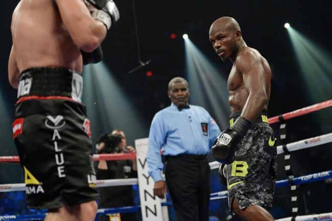 LAS VEGAS, NV - OCTOBER 12: WBO welterweight champion Timothy Bradley Jr. (R) taunts Juan Manuel Marquez during their bout at the Thomas & Mack Center on October 12, 2013 in Las Vegas, Nevada. Timothy Bradley Jr. wins in a split-decision victory over Juan Manuel Marquez. (Photo by Jeff Bottari/Getty Images)
