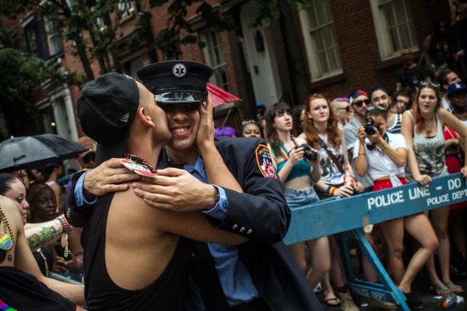 NEW YORK, NY - JUNE 30: Two men share a kiss during the New York Gay Pride Parade on June 30, 2013 in New York City. This year's parade was a particularly festive occasion, due to the recent Supreme Court Ruling that it was unconstitutional to ban gay marriage. (Photo by Andrew Burton/Getty Images)
