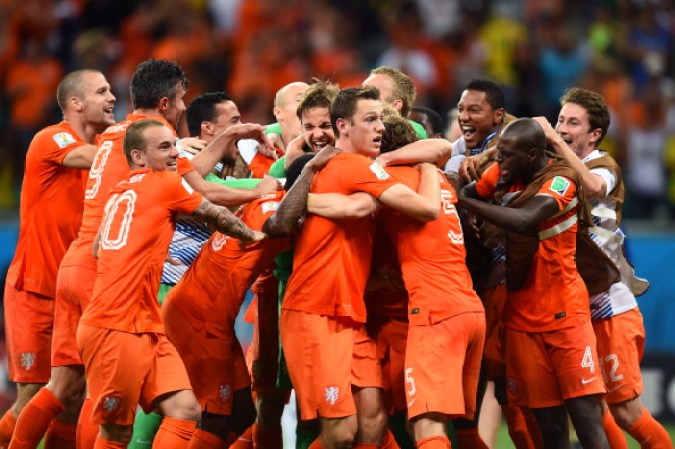 SALVADOR, BRAZIL - JULY 05: Goalkeeper Tim Krul of the Netherlands celebrates with teammates after making a save in a penalty shootout to defeat Costa Rica during the 2014 FIFA World Cup Brazil Quarter Final match between the Netherlands and Costa Rica at Arena Fonte Nova on July 5, 2014 in Salvador, Brazil. (Photo by Jamie McDonald/Getty Images)