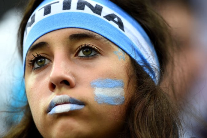 SAO PAULO, BRAZIL - JULY 09: An Argentina fan enjoys the atmosphere prior to the 2014 FIFA World Cup Brazil Semi Final match between the Netherlands and Argentina at Arena de Sao Paulo on July 9, 2014 in Sao Paulo, Brazil. (Photo by Matthias Hangst/Getty Images)