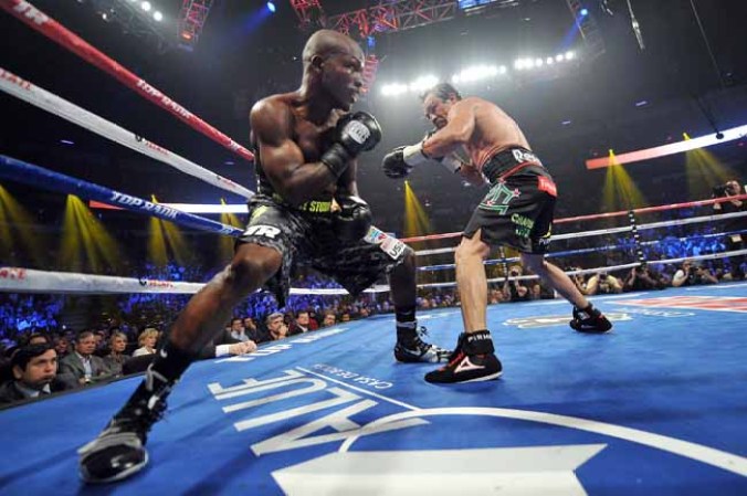 LAS VEGAS, NV - OCTOBER 12: Juan Manuel Marquez (R) looks to strike WBO welterweight champion Timothy Bradley Jr. during their bout at the Thomas & Mack Center on October 12, 2013 in Las Vegas, Nevada. Timothy Bradley Jr. wins in a split-decision victory over Juan Manuel Marquez. (Photo by Jeff Bottari/Getty Images)