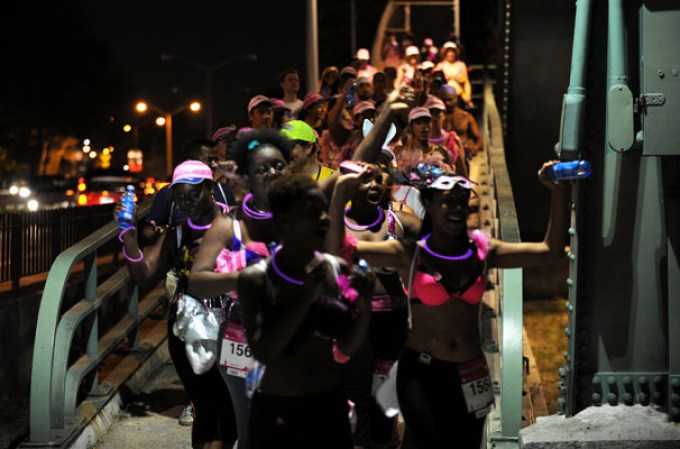 NEW YORK, NY - JULY 21: Participants attend the first-ever MoonWalk NYC at Randall's Island on July 21, 2013 in New York City. (Photo by Bryan Bedder/Getty Images for Walk the Walk)