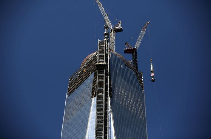 NEW YORK, NY - MAY 02: The 408-foot spire is hoisted onto a temporary platform on the top of One World Trade Center on May 2, 2013 in New York City. When bolted into place at a later date, the spire will make One World Trade Center the tallest building in the Western Hemisphere.The raising of the spire, which comes on the second anniversary of the death of Osama bin Laden, will make One World Trade Center 1,776 feet tall. One World Trade Center is built on the site where the September 11, 2001 attacks toppled the original World Trade Center towers. (Photo by Spencer Platt/Getty Images)