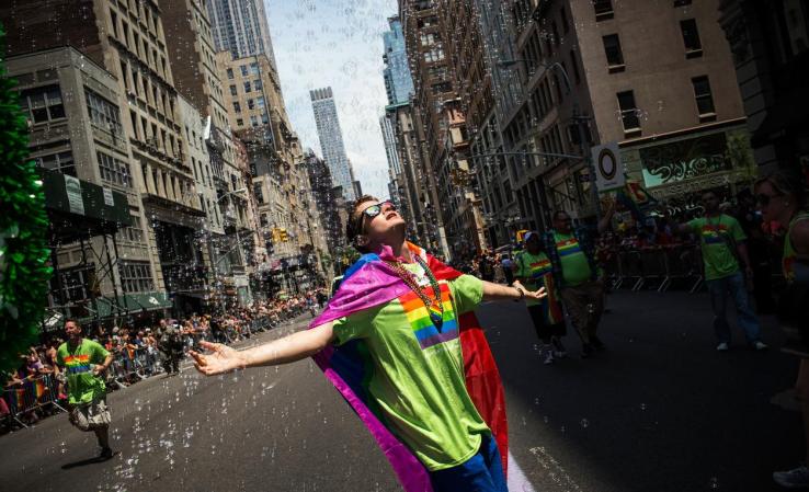 NEW YORK, NY - JUNE 30: Revelers march in the New York Gay Pride Parade on June 30, 2013 in New York City. This year's parade was a particularly festive occasion, due to the recent Supreme Court Ruling that it was unconstitutional to ban gay marriage. (Photo by Andrew Burton/Getty Images)