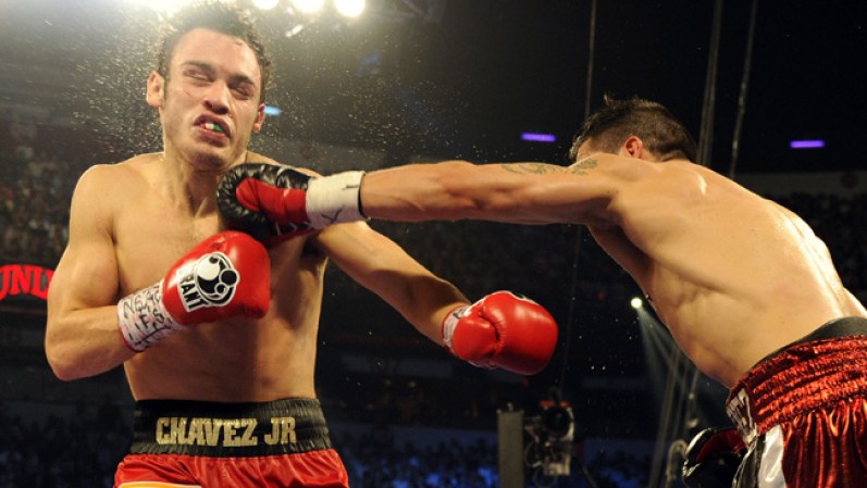 LAS VEGAS, NV - SEPTEMBER 15: Sergio Martinez (R) lands a left to the chin of Julio Cesar Chavez Jr. in the tenth round of their WBC middleweight title fight at the Thomas & Mack Center on September 15, 2012 in Las Vegas, Nevada. (Photo by Jeff Bottari/Getty Images)