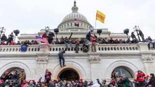 In this Jan. 6, 2021, file photo, protesters seen all over Capitol building where pro-Trump supporters riot and breached the Capitol. Rioters broke windows and breached the Capitol building in an attempt to overthrow the results of the 2020 election.