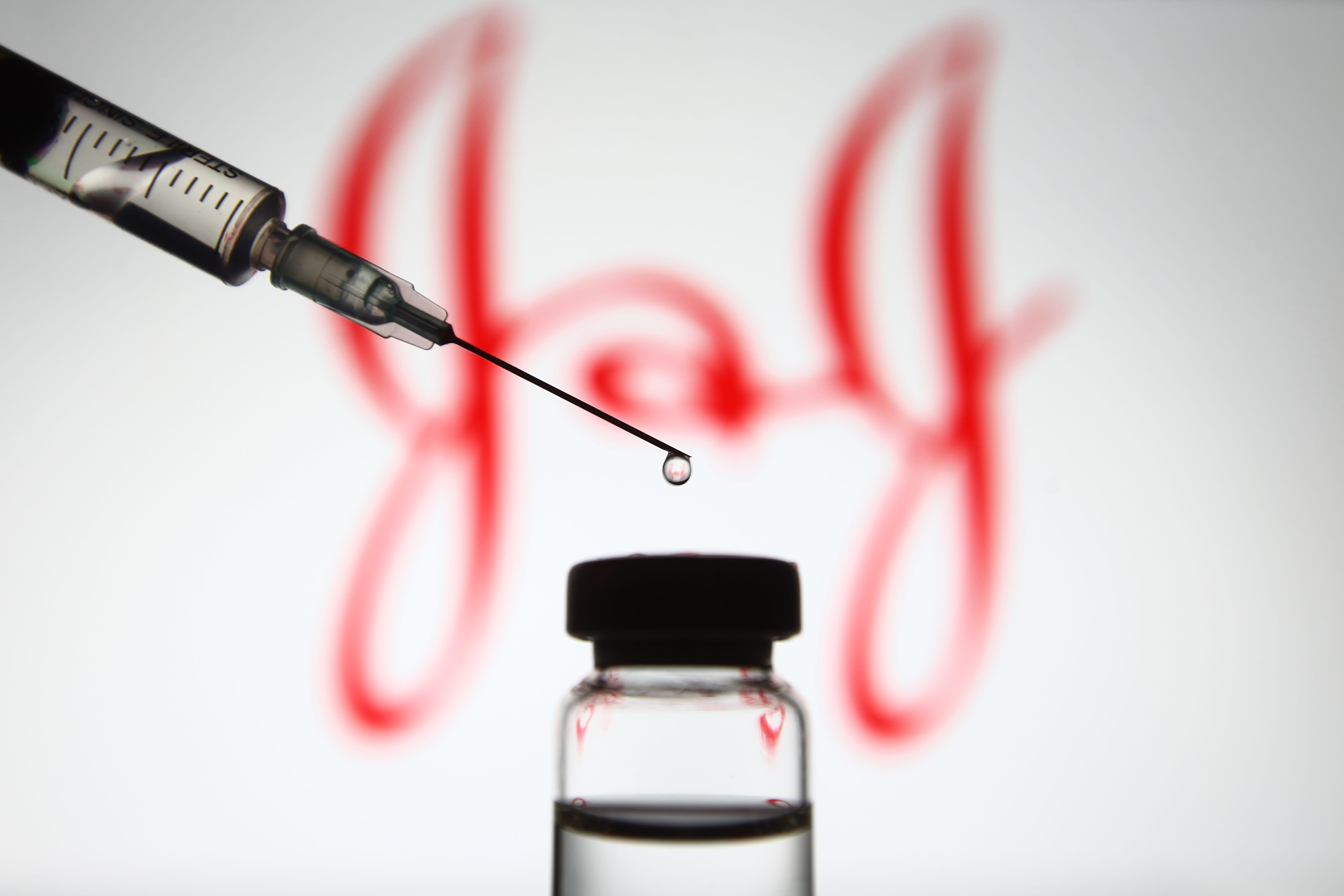 Johnson & Johnson logo, syringe and drug