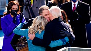 US President Joe Biden(R) is comforted by his son Hunter Biden and First Lady Jill Biden after being sworn in during the 59th presidential inauguration in Washington, DC on the West Front of the US Capitol on January 20, 2021 in Washington, DC.