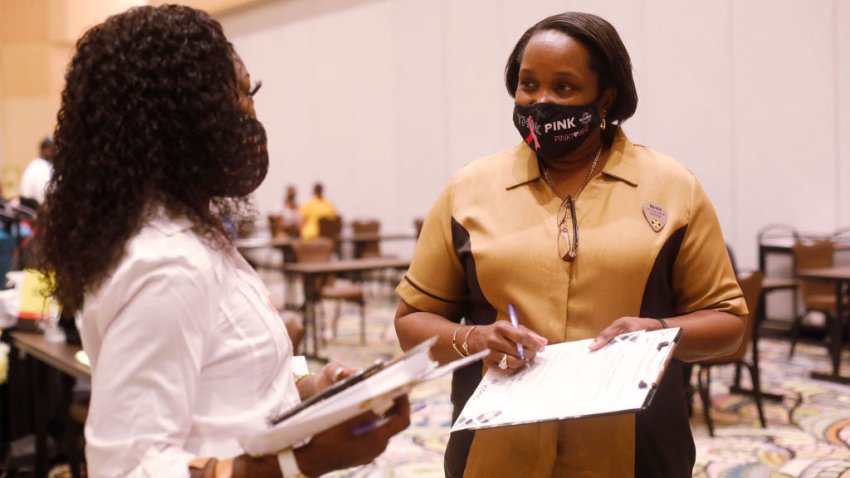 TAMPA, FL – MAY 25: Seminole Hard Rock Casino department manager Marsha Philgence-Edward (R) speaks with a job applicant during a job fair at the Seminole Hard Rock Casino on May 25, 2021 in Tampa, Florida. The Florida Department of Economic Opportunity announced that the state government will stop paying the $300-a-week federal benefit urging residents to return to the workforce. (Photo by Octavio Jones/Getty Images)