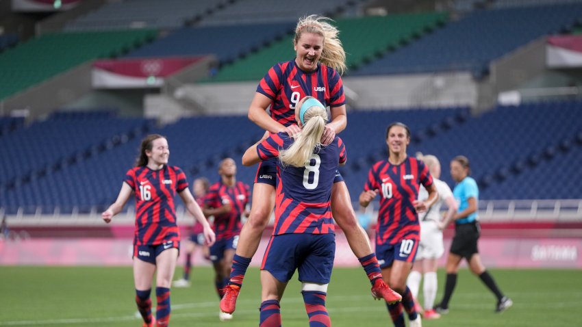 The U.S. women's soccer team celebrates in their game against New Zealand
