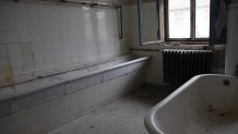 (GERMANY OUT) Germany - Brandenburg - Elstal: Deserted houses for the athletes in the former Olympic Village (Olympic Games 1936 in Berlin).  A wasted bathroom at the "Jesse Owens House"  (Photo by Montag/ullstein bild via Getty Images)