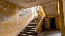 ELSTAL, GERMANY - MAY 17: Inside view of the abandoned Hindenburghaus facility where functions and cultural shows were staged at the site of the 1936 Berlin Olympic Village on May 17, 2021 in Elstal, Germany. A German real estate developer called Terraplan is constructing and renovating buildings on a large portion of the former Olympic Village site in what local authorities are hoping is the first phase of investor commitment to developing the entire site. Built for the 1936 Berlin Olympics the village later served as an infantry school for the Nazi-era Wehrmacht and a military hospital during World War II. After the war the Soviet Army took it over as a military base and also as a training facility for its own Olympic athletes. A number of the original buildings still stand at the site, including housing for athletes, a swim hall, a gym, other training facilities and a theatre. Located just west of Berlin, the site has finally become interesting to investors due to the rapid rise in value of the Berlin real estate market over the last decade. (Photo by Maja Hitij/Getty Images)