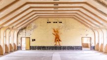 ELSTAL, GERMANY - MAY 17: A drawing of Russian revolutionary leader Vladimir Ilyich Lenin can be seen on the wall of the main amphitheatre in the abandoned Hindenburghaus facility where functions and cultural shows were staged at the site of the 1936 Berlin Olympic Village on May 17, 2021 in Elstal, Germany. A German real estate developer called Terraplan is constructing and renovating buildings on a large portion of the former Olympic Village site in what local authorities are hoping is the first phase of investor commitment to developing the entire site. Built for the 1936 Berlin Olympics the village later served as an infantry school for the Nazi-era Wehrmacht and a military hospital during World War II. After the war the Soviet Army took it over as a military base and also as a training facility for its own Olympic athletes. A number of the original buildings still stand at the site, including housing for athletes, a swim hall, a gym, other training facilities and a theatre. Located just west of Berlin, the site has finally become interesting to investors due to the rapid rise in value of the Berlin real estate market over the last decade. (Photo by Maja Hitij/Getty Images)