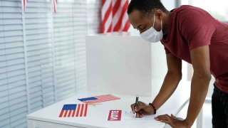 Man,Voting,In,Face,Mask