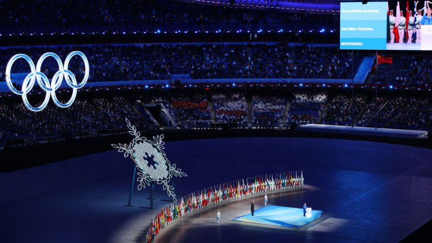 BEIJING, CHINA – FEBRUARY 04: Thomas Bach, IOC President makes a speech as performers hold flags of all participating countries during the Opening Ceremony of the Beijing 2022 Winter Olympics at the Beijing National Stadium on February 04, 2022 in Beijing, China. (Photo by Adam Pretty/Getty Images)