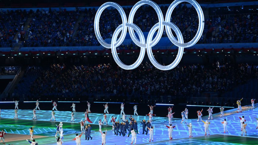 BEIJING, CHINA – FEBRUARY 04: Flag bearers Deividas Kizala and Paulina Ramanauskaite of Team Lithuania lead their team out during the Opening Ceremony of the Beijing 2022 Winter Olympics at the Beijing National Stadium on February 04, 2022 in Beijing, China. (Photo by Matthias Hangst/Getty Images)