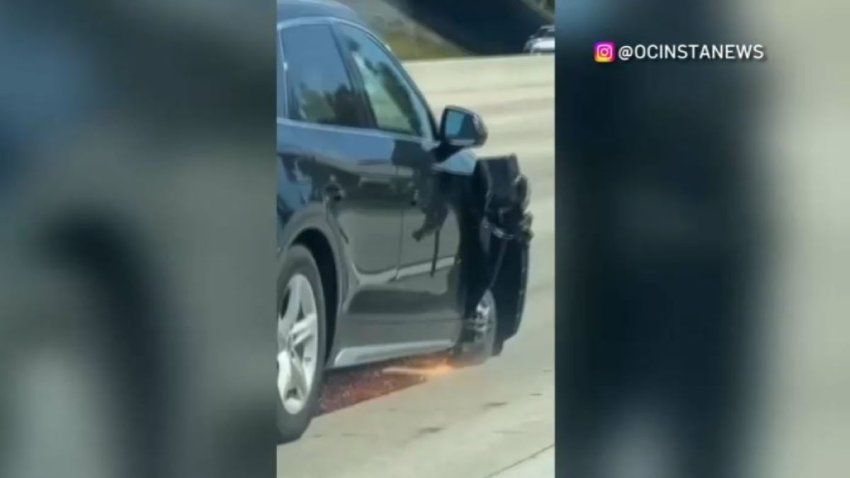 Sparks shoot from a damaged wheel on an Audi SUV.