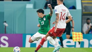 Jorge Sanchez of Mexico battles for the ball with Jakub Kiwior of Poland during the Group C FIFA World Cup Qatar 2022 match between Mexico and Poland at Stadium 974, Nov. 22, 2022, in Doha, Qatar.