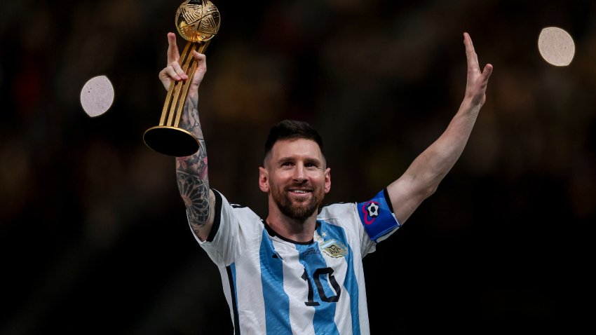 Lionel Messi of Argentina reacts as he holds the adidas Golden Boot award after the FIFA World Cup Qatar 2022 Final match between Argentina and France at Lusail Stadium on December 18, 2022 in Lusail City, Qatar.