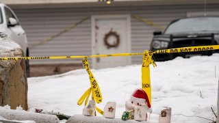 Objects left for a makeshift memorial sit outside the home in which four University of Idaho students were killed on Nov. 13, 2022, in Moscow, Idaho.