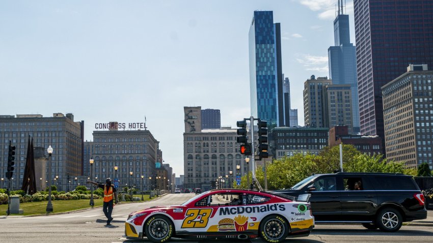 NASCAR driver Bubba Wallace drives through Grant Park on Tuesday July 19, 2022, in Chicago after Mayor Lori Lightfoot announced the city will host a NASCAR street race next year.  (Armando L. Sanchez/Chicago Tribune/Tribune News Service via Getty Images)