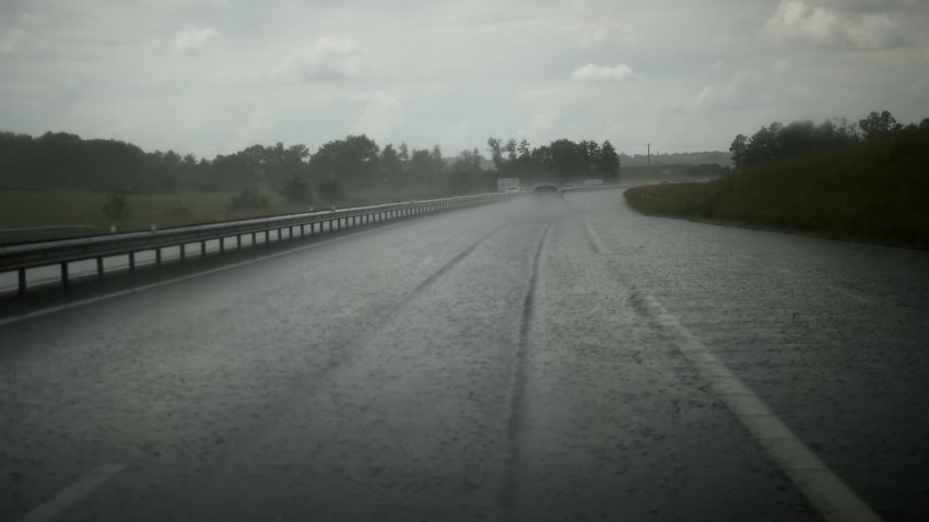 TOPSHOT – A picture taken on June 8, 2018 shows cars driving through storm on the A71 in Epineul-Le-Fleuriel. (Photo by GUILLAUME SOUVANT / AFP)        (Photo credit should read GUILLAUME SOUVANT/AFP via Getty Images)