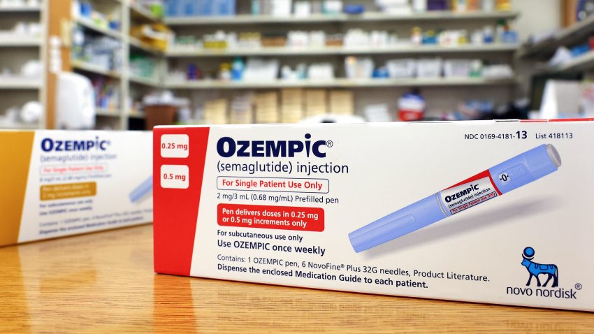 In this photo illustration, boxes of the diabetes drug Ozempic rest on a pharmacy counter on April 17, 2023 in Los Angeles, California.