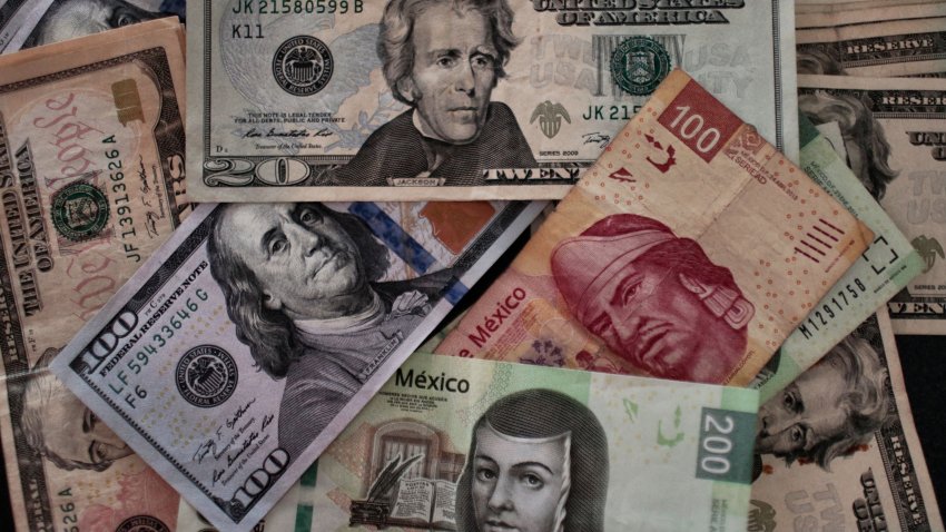 Bank notes of Mexican pesos and US Dollars are pictured in Mexico City, on January 19, 2017. (Photo by PEDRO PARDO / AFP) (Photo by PEDRO PARDO/AFP via Getty Images)