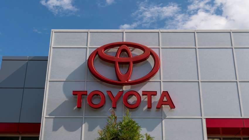 Toyota company logo seen on one of their car dealerships showrooms.