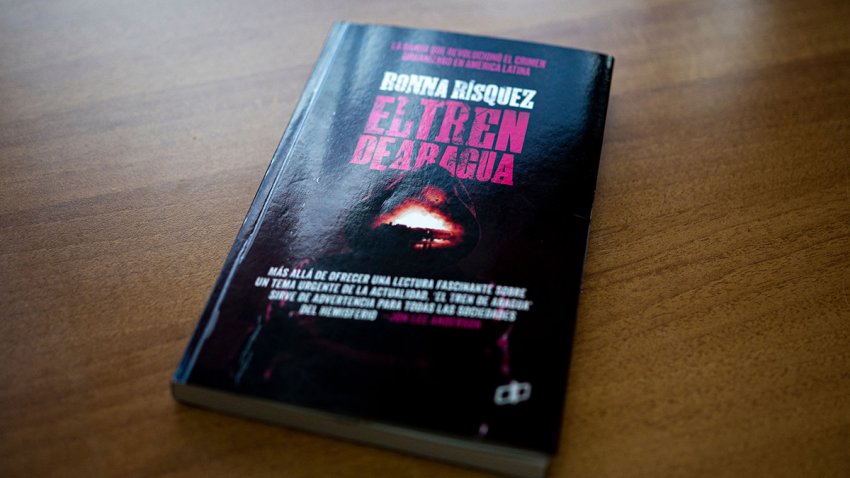 View of the cover of the book “El tren de Aragua” (“The train of Aragua”), written by Venezuelan investigative journalist Ronna Risquez, in Caracas on March 22, 2023. – In a few years, the “Tren de Aragua” gang has become a multipurpose Venezuelan crime multinational, reveals Ronna Risquez in a book event that earned her death threats. (Photo by AFP stringer / AFP) (Photo by AFP STRINGER/AFP via Getty Images)