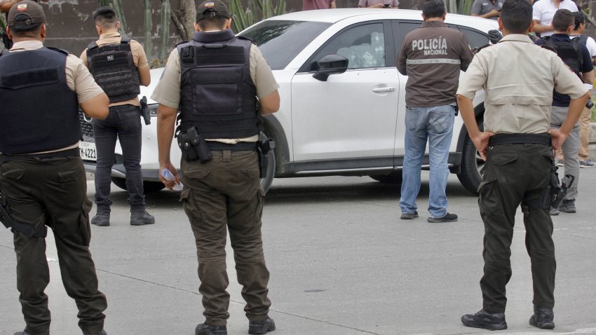 Members of the National Police inspect the car in which Prosecutor Cesar Suarez was at the moment he was shot dead in Guayaquil, Ecuador on January 17, 2024. A prosecutor charged with investigating the dramatic live-broadcast armed assault last week on an Ecuadoran television station was shot dead Wednesday, the country’s attorney general said. “In the face of the murder of our colleague Cesar Suarez … I am going to be emphatic: organized crime groups, criminals, terrorists will not stop our commitment to Ecuadoran society,” said Attorney General Diana Salazar in a statement on X. (Photo by CHRISTIAN VINUEZA / AFP) (Photo by CHRISTIAN VINUEZA/AFP via Getty Images)