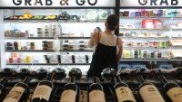 A shopper looks at food items at Foxtrot, 1576 N. Milwaukee Ave., Tuesday, July 20, 2021, in Chicago. The upscale convenience store is planning to open 50 new stores in the next two years. (John J. Kim/Chicago Tribune/Tribune News Service via Getty Images)