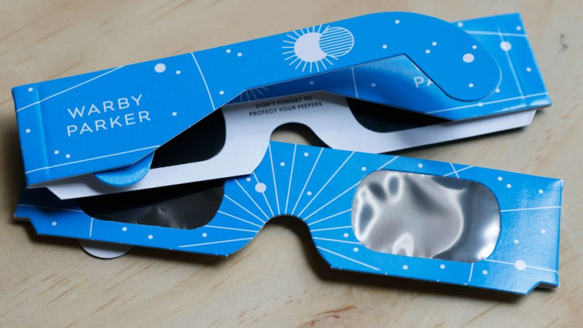 NEW YORK, NEW YORK – APRIL 01: In this photo illustration, eclipse glasses from Warby Parker are seen on a table on April 01, 2024 in New York City. Warby Parker announced that it will be offering free glasses certified for safe viewing of the upcoming solar eclipse on April 8. People can visit any store to receive up to two pairs of solar eclipse glasses at no cost. The event will mark the last total solar eclipse that is visible from the United States until 2044. (Photo Illustration by Michael M. Santiago/Getty Images)