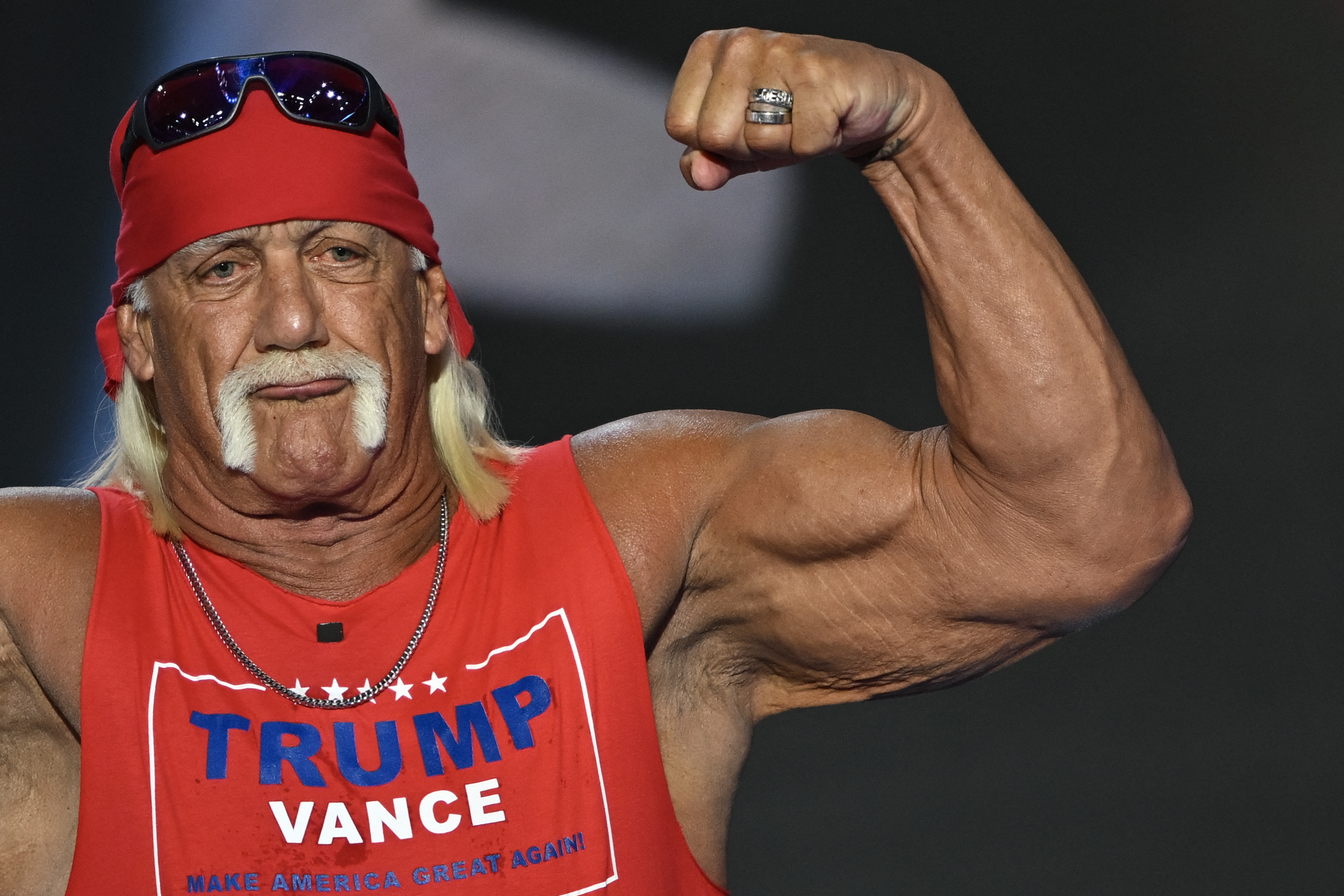 Pro-wrestler Hulk Hogan flexes his muscles after speaking during the last day of the 2024 Republican National Convention at the Fiserv Forum in Milwaukee, Wisconsin, on July 18, 2024.