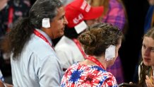 MILWAUKEE, WISCONSIN - JULY 17: People wear "bandages" on their ears on the third day of the Republican National Convention at the Fiserv Forum on July 17, 2024 in Milwaukee, Wisconsin. Delegates, politicians, and the Republican faithful are in Milwaukee for the annual convention, concluding with former President Donald Trump accepting his party's presidential nomination. The RNC takes place from July 15-18.  (Photo by Leon Neal/Getty Images)