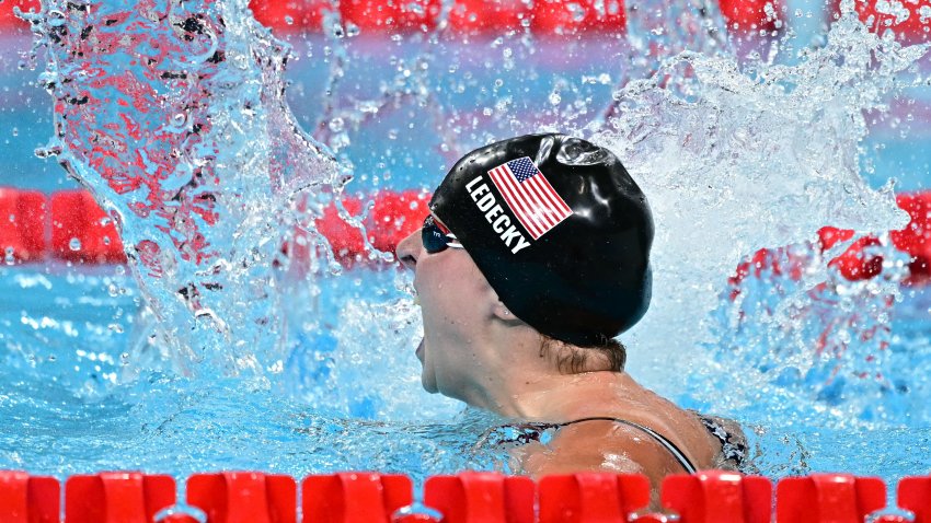 US’ Katie Ledecky celebrates after winning the final of the women’s 1500m freestyle swimming event during the Paris 2024 Olympic Games at the Paris La Defense Arena in Nanterre, west of Paris, on July 31, 2024. (Photo by Manan VATSYAYANA / AFP) (Photo by MANAN VATSYAYANA/AFP via Getty Images)