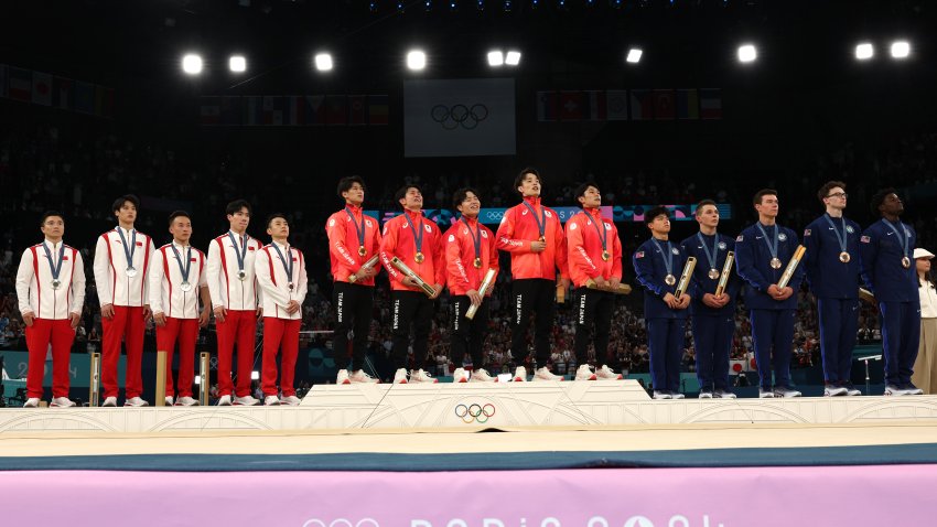 PARIS, FRANCE – JULY 29: (L-R) Silver medalists Team People’s Republic of China , Gold medalists Team Japan and Bronze medalists Team United States celebrate on the podium during the medal ceremony for the Artistic Gymnastics Men’s Team Final on day three of the Olympic Games Paris 2024 at Bercy Arena on July 29, 2024 in Paris, France. (Photo by Jamie Squire/Getty Images)