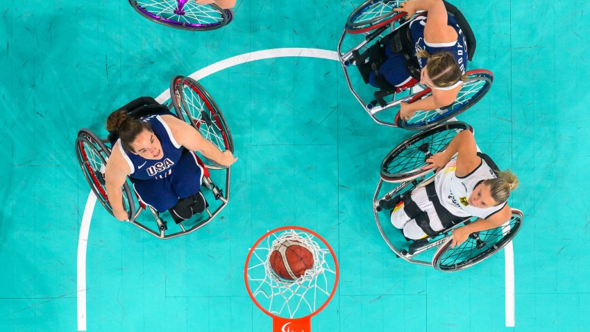 US’ Becca Murray (L) and Germany’s Swenja Mayer (Bottom_R) compete in the Women’s Wheelchair Basketball match in the Preliminary round group B, during the Paris 2024 Paralympic Games at the Bercy Arena in Paris, on August 30, 2024. (Photo by François-Xavier MARIT / AFP) (Photo by FRANCOIS-XAVIER MARIT/AFP via Getty Images)