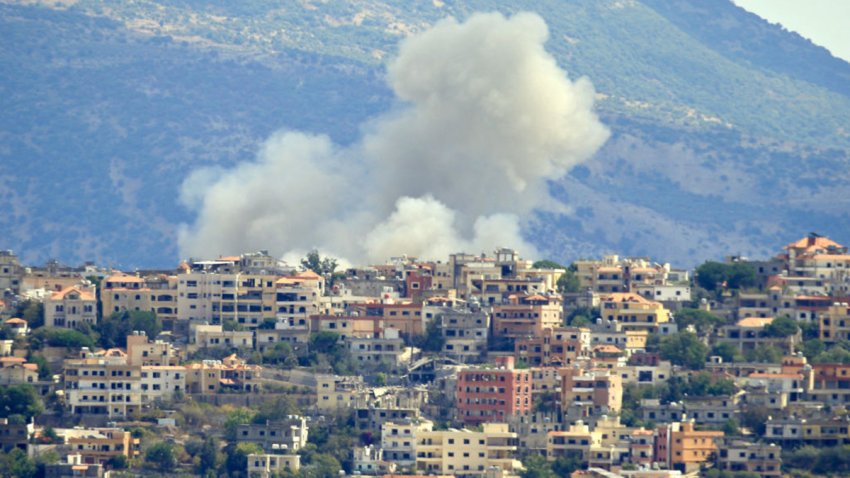 TOPSHOT – Smoke billows from the site of an Israeli airstrike in the southern Lebanese village of Khiam near the border on September 19, 2024. Lebanon’s Hezbollah has traded near-daily fire with Israeli forces in support of ally Hamas since the Palestinian militant group’s October 7 attack triggered war in the Gaza Strip, with repeated escalations during more than 11 months of the cross-border violence. (Photo by AFP) (Photo by -/AFP via Getty Images)