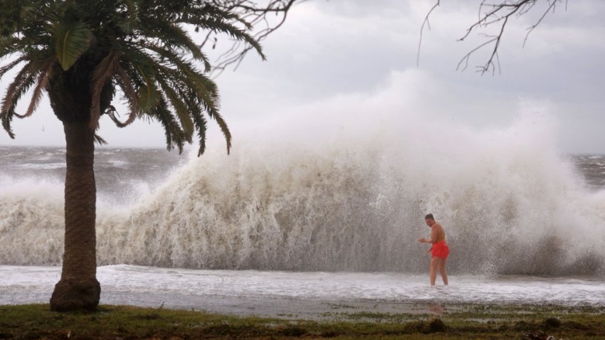 ST. PETERSBURG, FLORIDA – SEPTEMBER 26: Tanner Flynn stands in shallow water near crashing waves as Hurricane Helene passes offshore on September 26, 2024, in St. Petersburg, Florida.  Helene is forecast to become a major hurricane, bringing the potential for deadly storm surges, flooding rain, and destructive hurricane-force winds along parts of the Florida West Coast. (Photo by Joe Raedle/Getty Images)