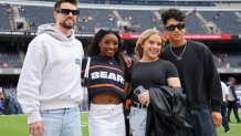 CHICAGO, ILLINOIS - SEPTEMBER 29: Gymnast Simone Biles poses for a photo on the field before the game between the Chicago Bears and the Los Angeles Rams at Soldier Field on September 29, 2024 in Chicago, Illinois. (Photo by Michael Reaves/Getty Images)