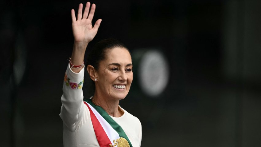 Mexico’s President Claudia Sheinbaum waves at the crowd as she leaves the Congress of the Union after her inauguration ceremony in Mexico City on October 1, 2024. (Photo by CARL DE SOUZA / AFP) (Photo by CARL DE SOUZA/AFP via Getty Images)