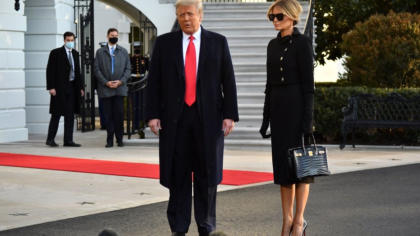 TOPSHOT – Outgoing US President Donald Trump and First Lady Melania Trump talk to the press as they depart the White House in Washington, DC, on January 20, 2021. – President Trump travels to his Mar-a-Lago golf club residence in Palm Beach, Florida, and will not attend the inauguration for President-elect Joe Biden. (Photo by MANDEL NGAN / AFP) (Photo by MANDEL NGAN/AFP via Getty Images)